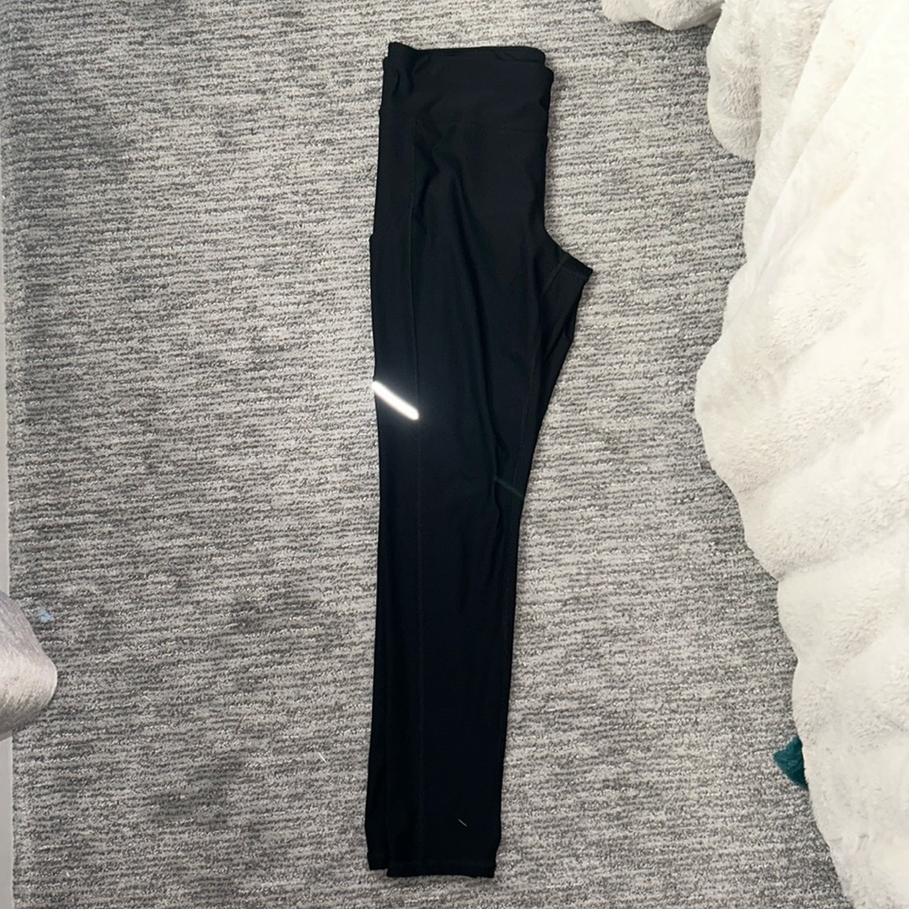 Black athletic leggings - Size L - one small hole in leg (in last picture)